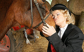 Smashing woman pleasing her pussy in a barn